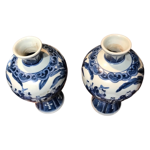 131 - A PAIR OF CHINESE MEIPING BLUE AND WHITE VASES 
Decorated with a partial interior scene showing figu... 