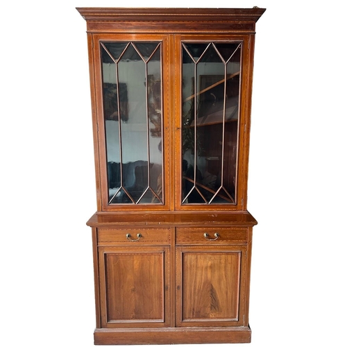 212 - MAPLE & CO., A LATE 19TH CENTURY INLAID MAHOGANY BOOKCASE
With glazed doors opening to reveal adjust... 