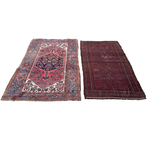 228 - TWO ANTIQUE CARPETS/RUG
To include red ground stylised geometrical border with repeating geometric c... 