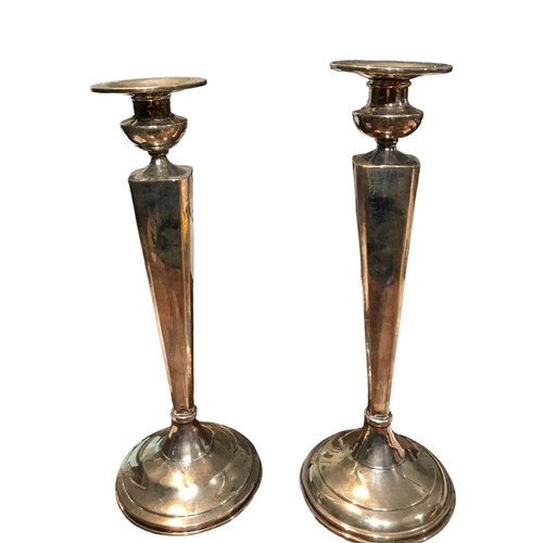 90b - DOMINICK & HAFF, 1869 - 1928, A PAIR OF AMERICAN STERLING SILVER CANDLESTICKS
Having ‘V’ shaped colu... 