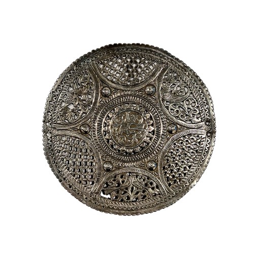 94c - THREE LATE 19TH/EARLY 20TH CENTURY TUNISIAN SILVER OBJECTS TO INCLUDE A FIBULA, PIERCED SILVER DISH ... 