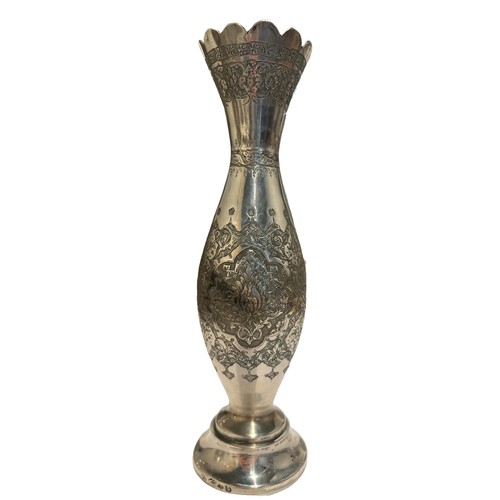 98c - A 20TH CENTURY PERSIAN/IRANIAN SILVER VASE
Having four floral chased relief panels, surrounded by fi... 