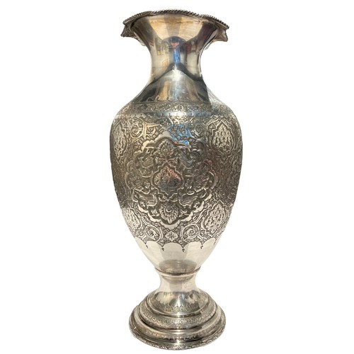 99b - A LARGE 20TH CENTURY PERSIAN/IRANIAN SILVER INVERTED BALUSTER FORM VASE 
Having four chased relief p... 