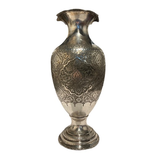 99b - A LARGE 20TH CENTURY PERSIAN/IRANIAN SILVER INVERTED BALUSTER FORM VASE 
Having four chased relief p... 