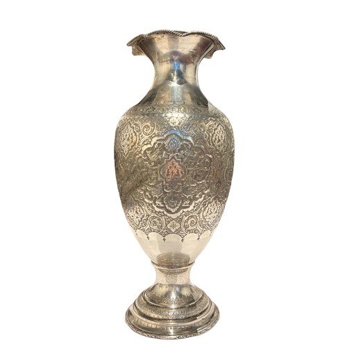 99b - A LARGE 20TH CENTURY PERSIAN/IRANIAN SILVER INVERTED BALUSTER FORM VASE 
Having four chased relief p... 