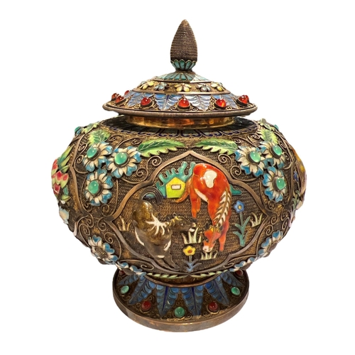 92c - A CHINESE TIBETAN SILVER GILT AND ENAMEL LIDDED POT
Decorated with filigree design, enamel flora and... 