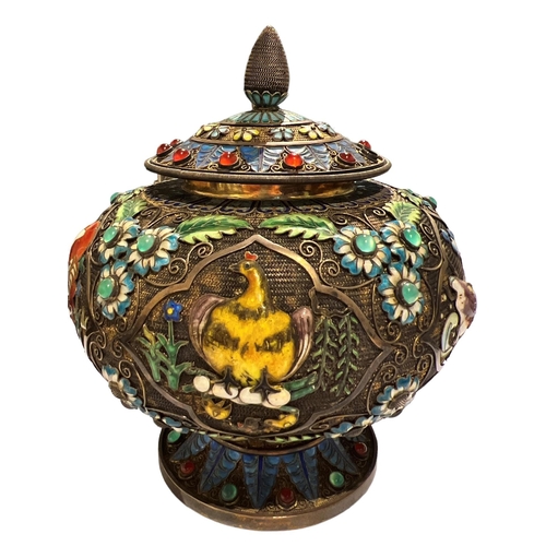 92c - A CHINESE TIBETAN SILVER GILT AND ENAMEL LIDDED POT
Decorated with filigree design, enamel flora and... 