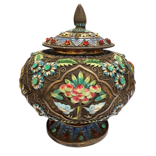 92c - A CHINESE TIBETAN SILVER GILT AND ENAMEL LIDDED POT
Decorated with filigree design, enamel flora and... 