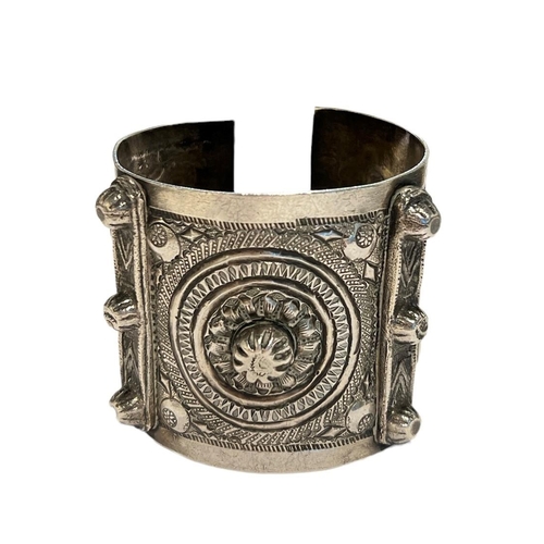 96c - A 19TH CENTURY ISLAMIC POSSIBLY LIBYAN SILVER BANGLE
Decorated geometric floral patterns with two pa... 