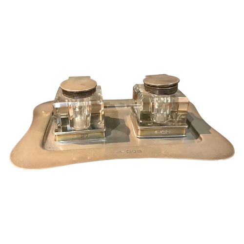 72b - JOHN GRINSELL & SONS, AN EDWARDIAN SILVER INK STAND
Having two separate detachable inkwell, hallmark... 