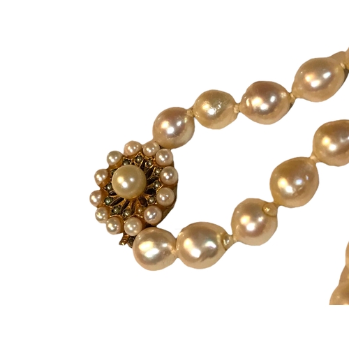 76A - A PEAR SHAPED SEA PEARL NECKLACE
With 9ct gold clasp, inset with a central round pearl with seed pea... 