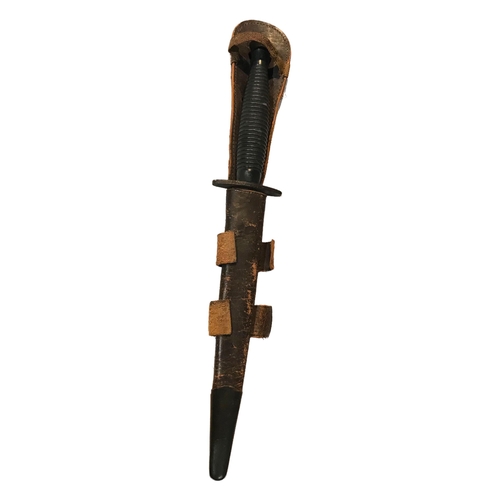 170A - A WORLD WAR TWO FAIRBAIRN-SYKES COMMANDO DAGGER HAVING LEATHER SHEATH.

Condition: AF