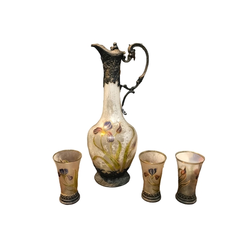 200A - A LATE 19TH/EARLY 20TH CENTURY ART NOUVEAU WHITE METAL AND PAINTED GLASS EWER
Together with three ma... 