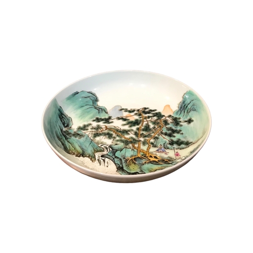 207 - A CHINESE REPUBLICAN FAMILLE VERTE SHALLOW BOWL DECORATED WITH A WATERFALL FIGURAL LANDSCAPE
With tw... 