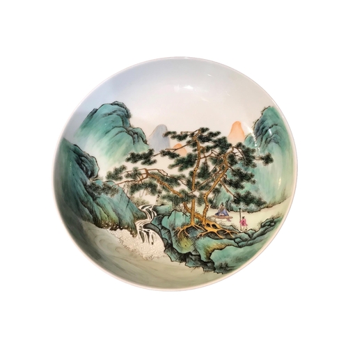 207 - A CHINESE REPUBLICAN FAMILLE VERTE SHALLOW BOWL DECORATED WITH A WATERFALL FIGURAL LANDSCAPE
With tw... 