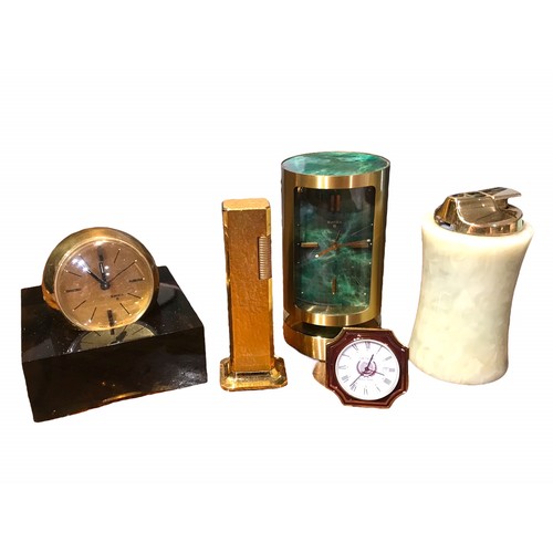 75c - DUNHILL, A GOLD PLATED TALLBOY LIGHTER AND RONSON TABLE LIGHTER

Together three desk clocks, two Swi... 