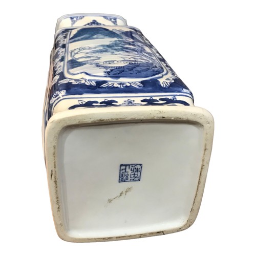 148 - A LARGE PAIR OF JAPANESE BLUE AND WHITE RECTANGULAR VASES
Decorated with a mountainous landscape sce... 