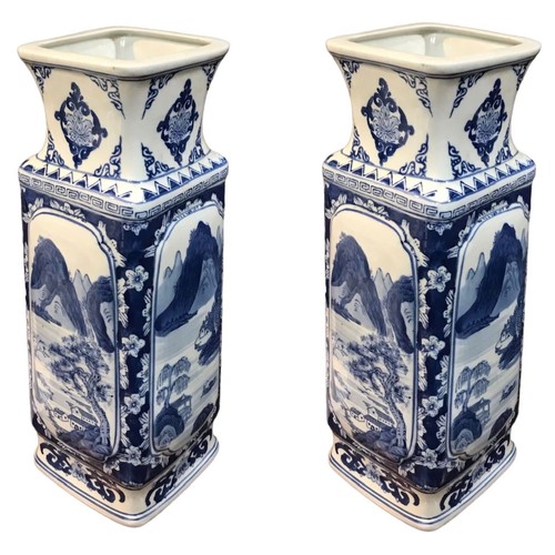 148 - A LARGE PAIR OF JAPANESE BLUE AND WHITE RECTANGULAR VASES
Decorated with a mountainous landscape sce... 