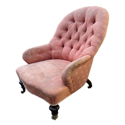 222 - A 19TH CENTURY VICTORIAN UPHOLSTERED NURSING CHAIR
Raised on turned mahogany legs terminating on cas... 