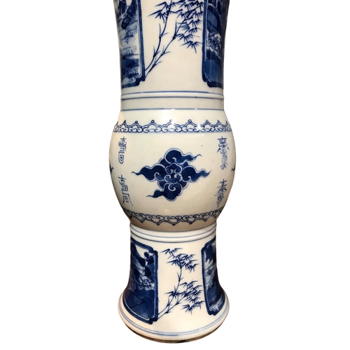 74 - A PAIR OF CHINESE BLUE AND WHITE GU BEAKER FORM VASES
Decorated with calligraphy in between landscap... 