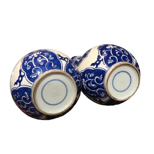 76 - A PAIR OF CHINESE BLUE AND WHITE SUANTOUPING GARLIC MOUTH SHAPED VASES
Decorated with geometric flor... 