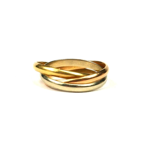 17 - AN 18CT TRICOLOURED GOLD TRINITY RING. 
(UK ring size M½, 6g)