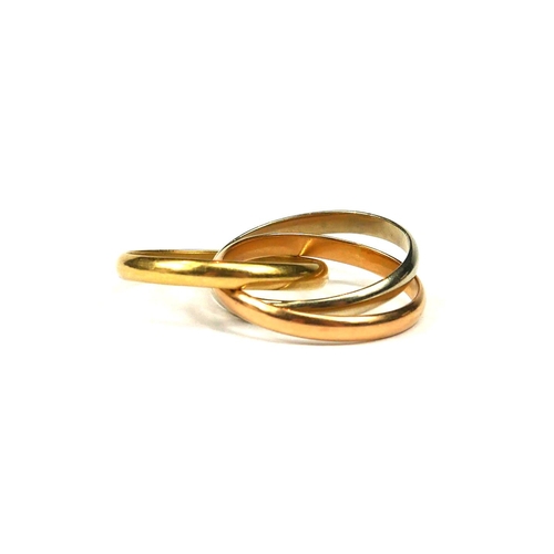 17 - AN 18CT TRICOLOURED GOLD TRINITY RING. 
(UK ring size M½, 6g)