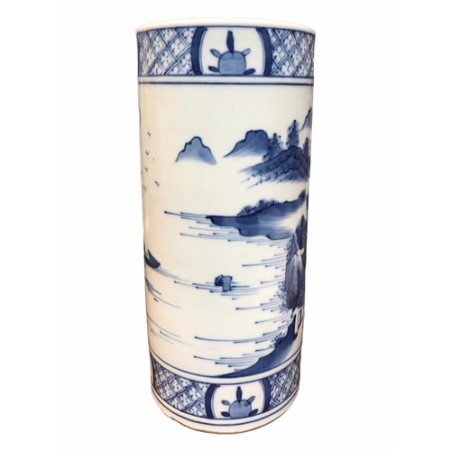 83 - A CHINESE BLUE AND WHITE BRUSH POT 
Decorated with a landscape scene with figure in a boat, met by b... 