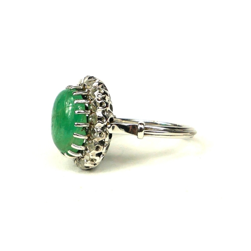 1A - WHITE METAL, LARGE OVAL CABOCHON EMERALD AND ROSE CUT DIAMONDS RING.  Emerald 4.00ct approx.  Diamon... 