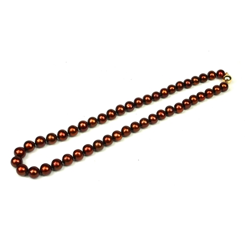 28 - STRING OF COCOA FRESHWATER CULTURED PEARLS with a 9ct yellow gold ball clasp