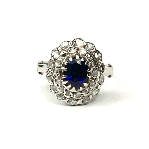 2A - A WHITE METAL, OVAL BLUE STONE AND ROSE CUT DIAMOND RING. (Blue stone 1.00ct approx. Diamonds 0.40ct... 