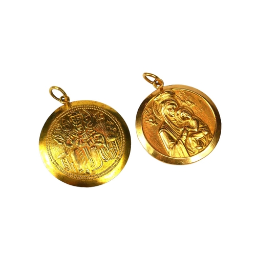 39 - A YELLOW METAL PENDANT DEPICTING MADONNA AND CHILD, TOGETHER WITH ANOTHER PENDANT.
(both tested for ... 