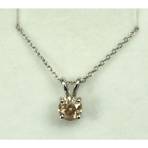4 - AN 18CT WHITE GOLD SOLITAIRE DIAMOND PENDANT ON A SILVER CHAIN.  (Approx Diamond 0.74ct)