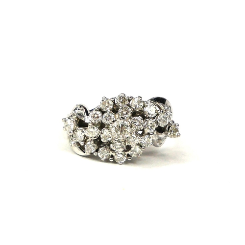 40 - A WHITE METAL & DIAMOND CLUSTER RING   Diamonds approx. 1.10ct