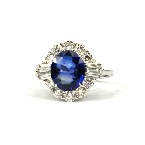 44 - AN 18CT WHITE GOLD OVAL SAPPHIRE AND DIAMOND CLUSTER RING with WGI Certificate  (Sapphire 2.83ct.  D... 