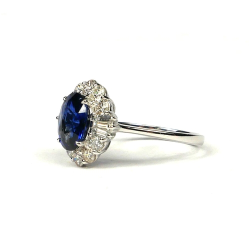 44 - AN 18CT WHITE GOLD OVAL SAPPHIRE AND DIAMOND CLUSTER RING with WGI Certificate  (Sapphire 2.83ct.  D... 