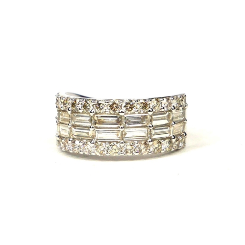 48 - A 9CT WHITE GOLD DIAMOND BAND set with baguette cut and round brilliant cut diamonds.  (Approx Diamo... 