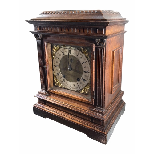 112 - LENZKIRCH, EARLY 20TH CENTURY OAK MANTLE CLOCK 
Having square brass dial with silvered chapter ring ... 