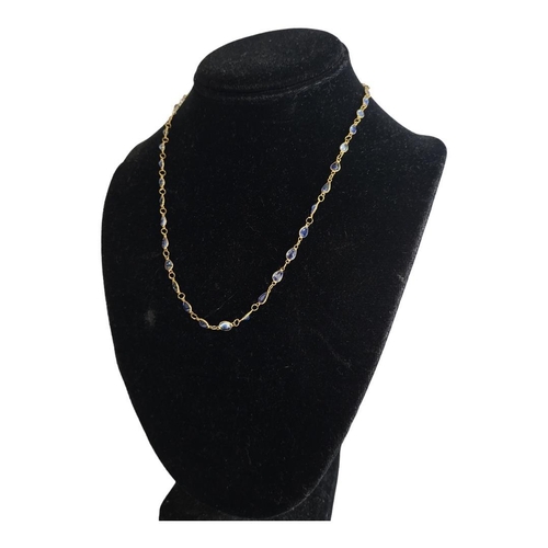 37A - 37a A YELLOW METAL AND SAPPHIRE NECKLACE
Having a row of graduated oval cut sapphires, with hook cla... 