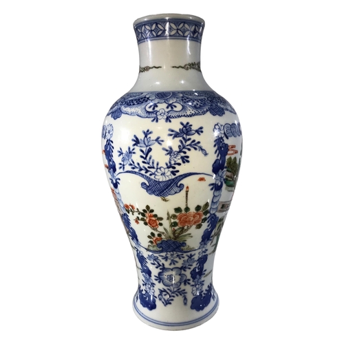 87 - A CHINESE FAMILLE VERTE VASE ON WHITE GROUND 
Figural scenes within blue floral panels, bearing blue... 
