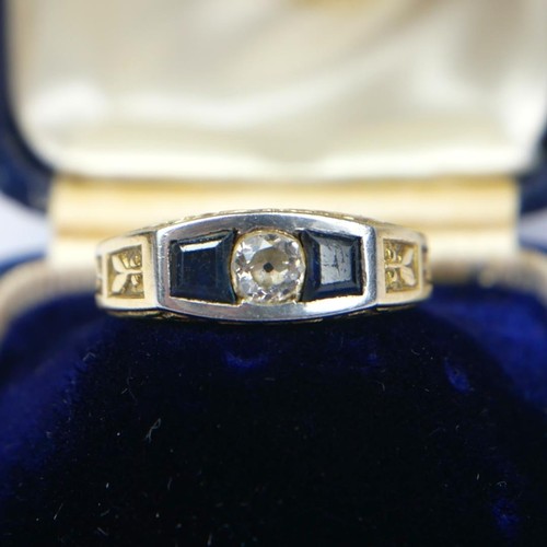 54 - ATTRIBUTED BOUCHERON, A YELLOW AND WHITE METAL, DIAMOND AND SAPPHIRE RING
Having central round cut d... 
