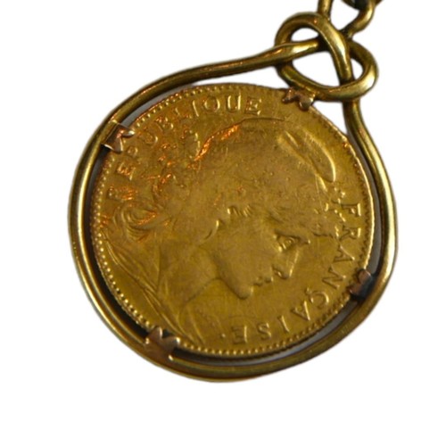 52 - A 1914 22CT GOLD 10 FRANC COIN MOUNTED IN A YELLOW METAL PENDANT MOUNT, CHAIN
Having Liberty head an... 