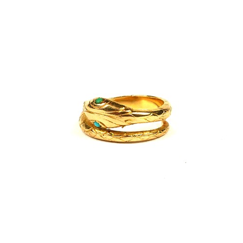 12A - AN EARLY 20TH CENTURY PORTUGUESE 19.2CT GOLD AND TURQUOISE SNAKE BYPASS RING.
(UK ring size L, gross... 