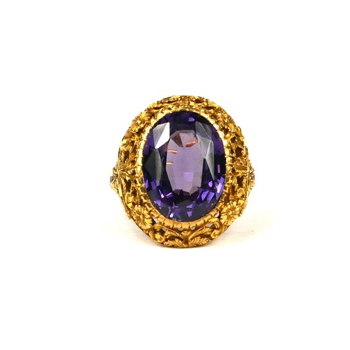 14A - A LARGE 19TH CENTURY/20TH CENTURY HIGH CARAT YELLOW METAL AND ALEXANDRITE RING
Having a chased flora... 