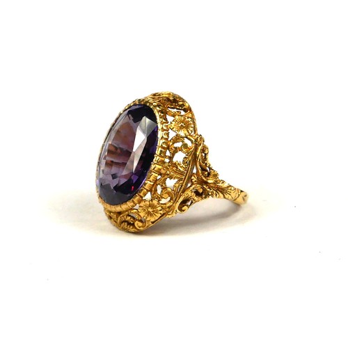 14A - A LARGE 19TH CENTURY/20TH CENTURY HIGH CARAT YELLOW METAL AND ALEXANDRITE RING
Having a chased flora... 