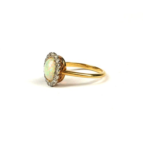 15A - AN 18CT YELLOW GOLD, OPAL AND 17 DIAMOND CLUSTER RING
Inside a Goldsmiths & Silversmiths, Regent Str... 