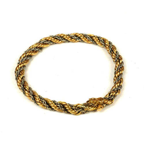 18A - AN ITALIAN 18CT YELLOW AND WHITE GOLD ROPE TWIST BRACELET.
(length 20.5cm, 16.7g)