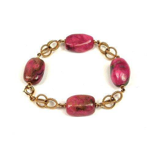 19A - A 14CT GOLD AND RHODONITE BRACELET.
(length 22.5cm, gross weight 46.8g)
