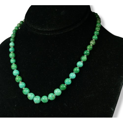 23A - A WHITE METAL AND DIAMOND CLASPED GREEN TURQUOISE NECKLACE, WHITE METAL.
(tested for 18ct, length 42... 