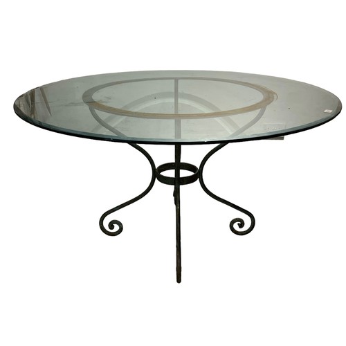 182 - A DECORATIVE 20TH CENTURY CIRCULAR WROUGHT IRON AND GLASS TOPPED CENTRE TABLE.
(h 73cm x diameter 13... 